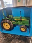 Ertl 581 John Deere Model Compact Utility Tractor Wide Front  1 16 Scale  1999