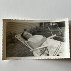 Vintage B w Snapshot Photograph 1950s Housewife Woman Taking A Nap Outside Odd