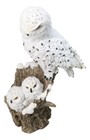 Snowy Owl Mother With Two Owlets Family Figurine On Snow-covered Tree Stump