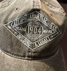 Caterpillar A Tractor Co Building A Legacy  Trade Mark 1904  Adj Cap  Gray