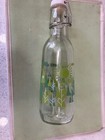 Lovely Functional  Bottle With Decorative Floral Design And Swing Top  10  Tall
