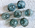 7 Japanese Antique Glass Fishing Floats W  Nets     Used     Approx  3 15  Dia