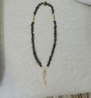 A Necklace Made From Clove Buds  Decorated With Beads  Handmade