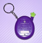 Tamagotchi Connection Virtual Pet Keychain Purple blue green Puzzle Shell 2004