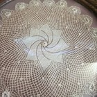Round Framed Wall Hanging Lace  Doily On Pink Background