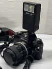 Nikon Em 35mm Slr Camera W case 2 Lenses 8 Rolls Film Flash