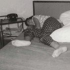 Vintage Snapshot Photo 1955 Honeymoon Woman Barefoot In Bed Polka Dot