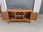 Wooden Dining Room Buffet With A Built-in Wine Rack And Two Cabinets  Used