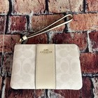 Coach Outlet Corner Zip Wristlet In Signature Canvas With Stripe Cw854