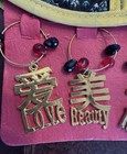 2 Asian Dress Themed Wine Bottle Covers And 4 Wine Glass Charms