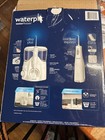 Waterpik Ultra Plus And Cordless Express Water Flosser  4 Tips And 1 Travel Bag
