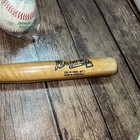 3 Baseballs And Braves Bat