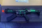 Airsoft Aeg Rifle With Green Accents