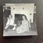    white Couple With Fake Cat Pet In Front Of Fireplace    Photo Portrait 1960s Nyc