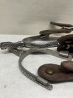 Vintage Western Cowboy Spurs Equipped With Star-shaped Rowels And Brown Leather