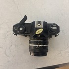 Nikon Em 35mm Slr Film Camera With Lens Cap