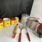 A Group Of Vintage Child Kitchen Items