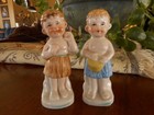 2 Vintage Antique Child Cherub Like Figurines Grass Skirt Tropical Kitsch Apx 4 