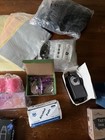 Assortment Of Tattoo Needles And The Supplies  With Guns Ink