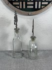 Set Of 2 Handblown Glass Bottles W metal Floral Accent Stoppers