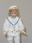 4  Miniature All Bisque Doll House Doll  Painted Features  Clothes Are Sewn On