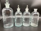 Group Of Four Embossed Stoppered Laboratory Glass Chemist Acid Bottles