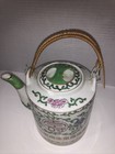 Vintage Chinese Porcelain Teapot With A Woven Handle And Hand Painted
