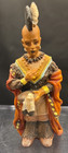 Native American Indian Sculptures Of Children Dressed In Different Costumes   