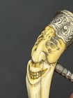 A Wonderfully Expressive Happy-face Carved Antique Handle Corkscrew Silver Cap
