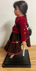 Native American  Porcelain Doll - In Sitting Postion With Stand