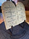 A Decorative Representation Of The Ten Commandments Inscribed On Two Faux Stone