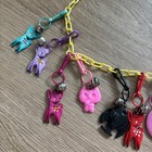 Vintage 80s Plastic Clip On Bell Charm Necklace  With 12 Charms