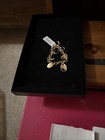 Gold Tone Charm Bracelet With Lobster Clasp