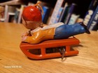Nice Vintage  Wind Up Celluloid Boy On A Tin Sled  Made In  Japan