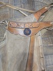 Vintage Western Chaps Feature A Hand-tooled Floral Motif On The Yoke