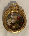 Ornate Gold Resin Picture Frame Features A Vintage-style Floral Pattern And Bow