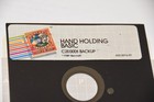 Vintage 1981 Hand Holding Basic Apple Computer Software Floppy Disk 652-2016-01