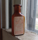 Sharp   Dohme Baltimore Emb With Labels Amber 3 Sided Poison Bottle