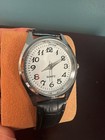 Quartz Analog Wristwatch White Dial Arabic Numerals Black Leather Strap Silver