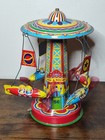 Vintage Schylling Rocket Ride Carosel Tin Toy works Great 