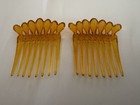 Antique vintage  A Pair Of Celluloid Amber Colored Hair Combs  Age Unknown 