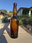 Vintage Base Embossed 10  Amber Whittled Applied Top Lady Ladies Leg Bottle