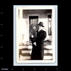 Old Vintage Photo Man Coat Hat Glasses Holding Boy Outside House Steps