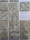 Partial Victorian Surround  Thirteen Tiles  Pots And Floral Arrangements