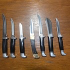 One Texans Collection Of Buck Knives 
