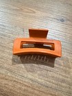 Clip With An Orange Clamp