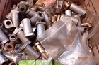 Pile Of Various New Used Parts Bushings Sleeves For Multi-spindle Drilling Heads