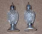 Pare Of Sterling Silver Weighted   Glass Saltshakers