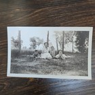 Vintage B w Photo Snapshot Of Young Family Laying Down In Grass For Picture