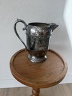 Vintage Silver Plate Water Pitcher Ornate Floral Rim Footed Serving Jug